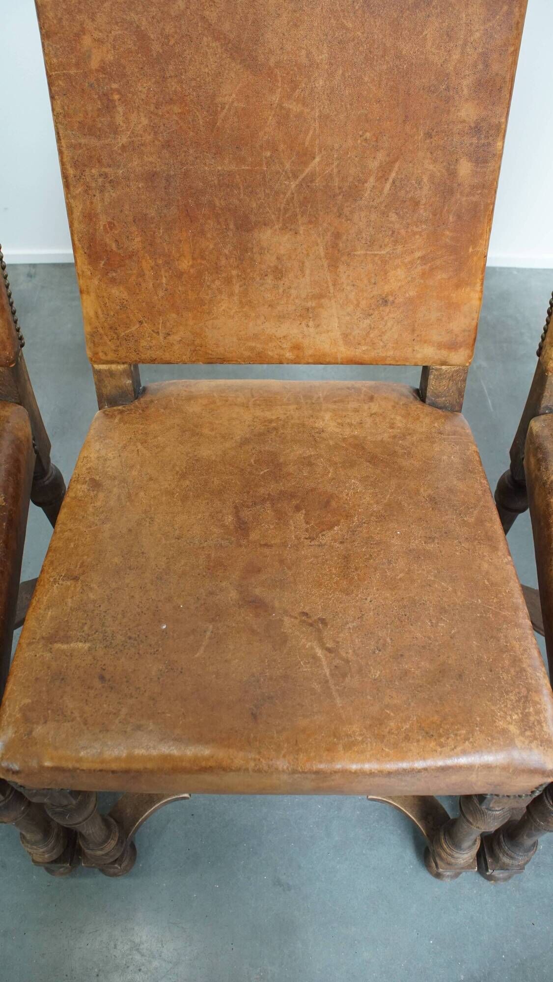 Set of 4 antique wooden and sheepskin leather dining chairs