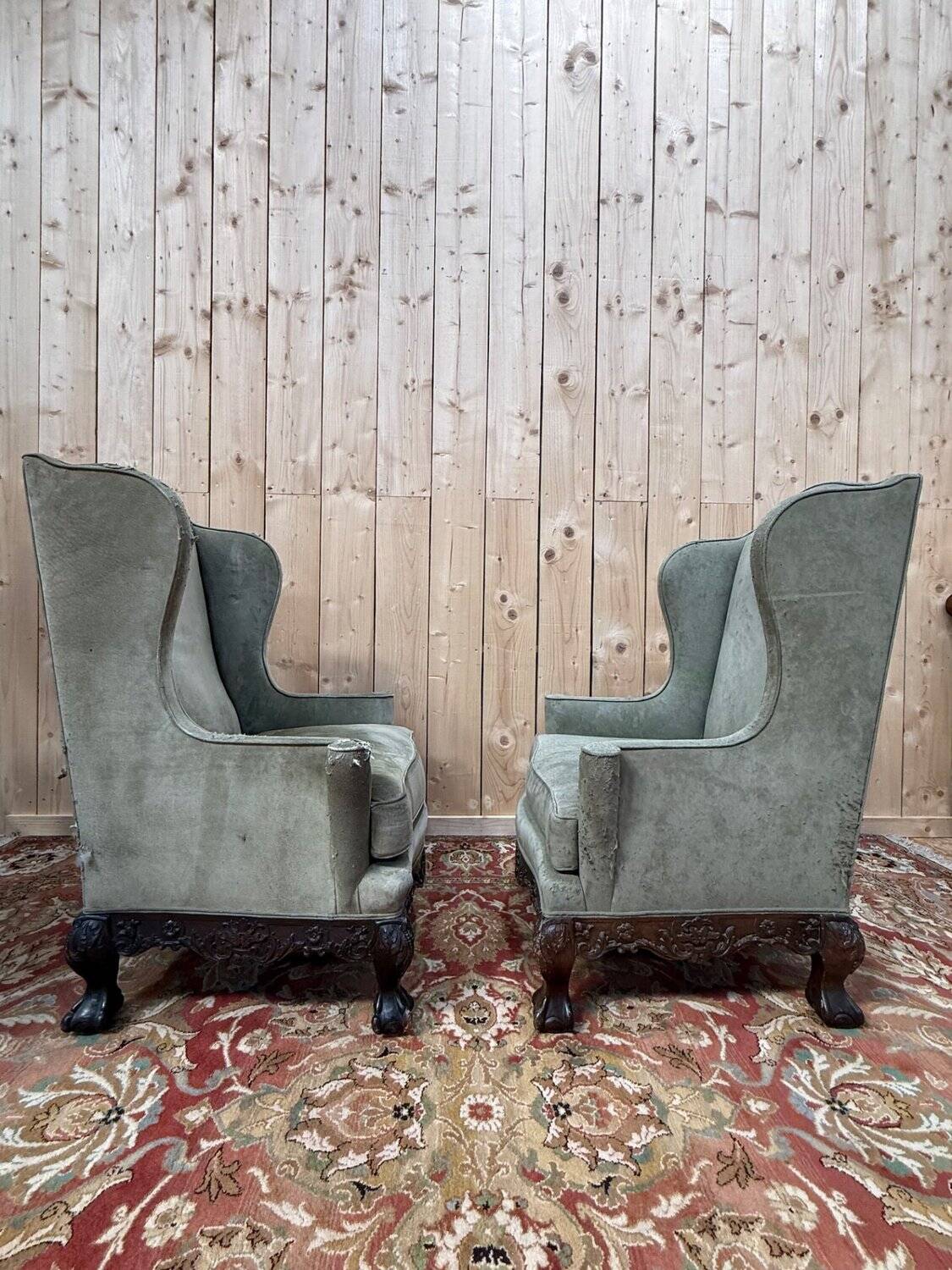 Pair of wingback armchairs in George III style – Carved wood – 18th century.