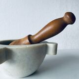 Old marble mortar with wooden pestle