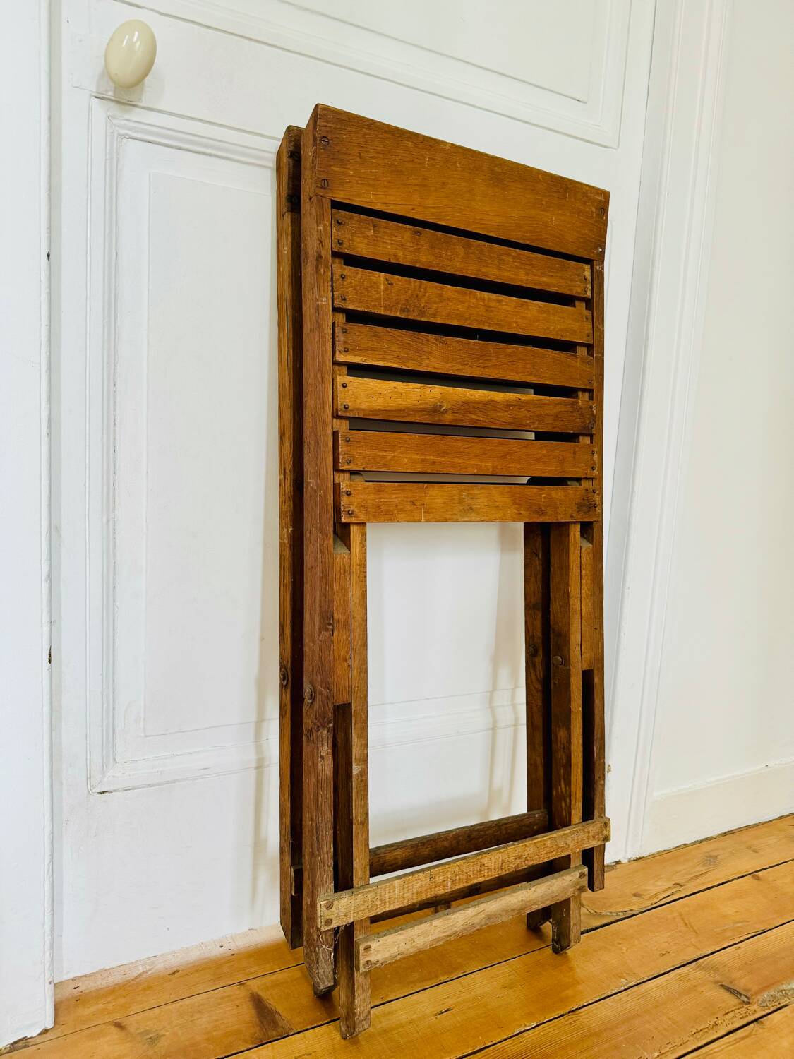 Two vintage wooden folding chairs, circa 1960