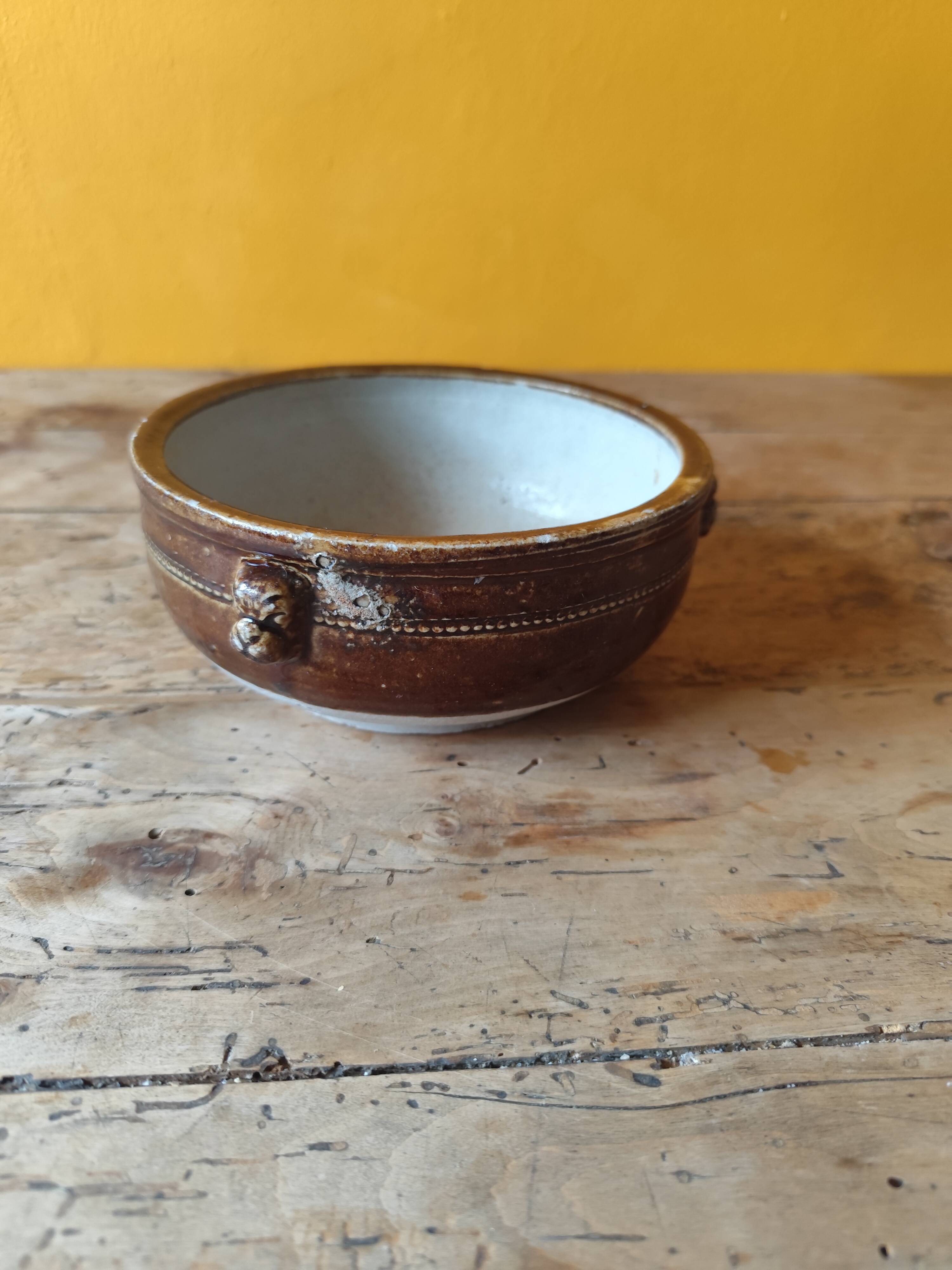 Old small glazed ceramic dish with lion head decoration - brown enamel kitchen bowl