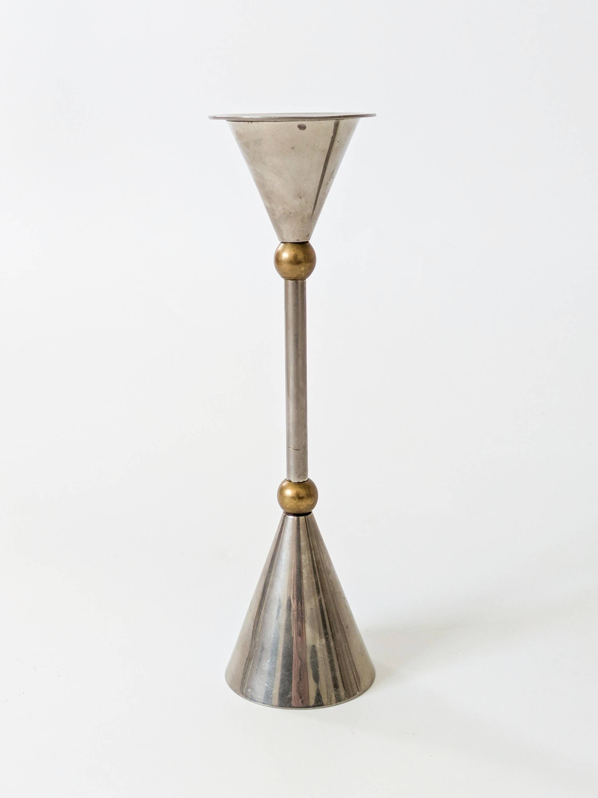 Pair of postmodern candlesticks in Memphis style made of steel and brass.