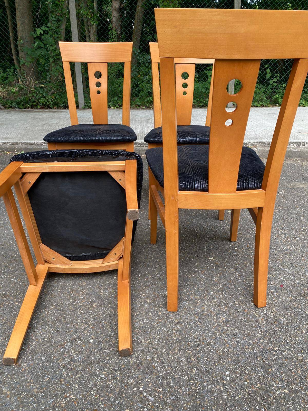 4 Scandinavian dining chairs in solid wood and black fabric from the 1990s.