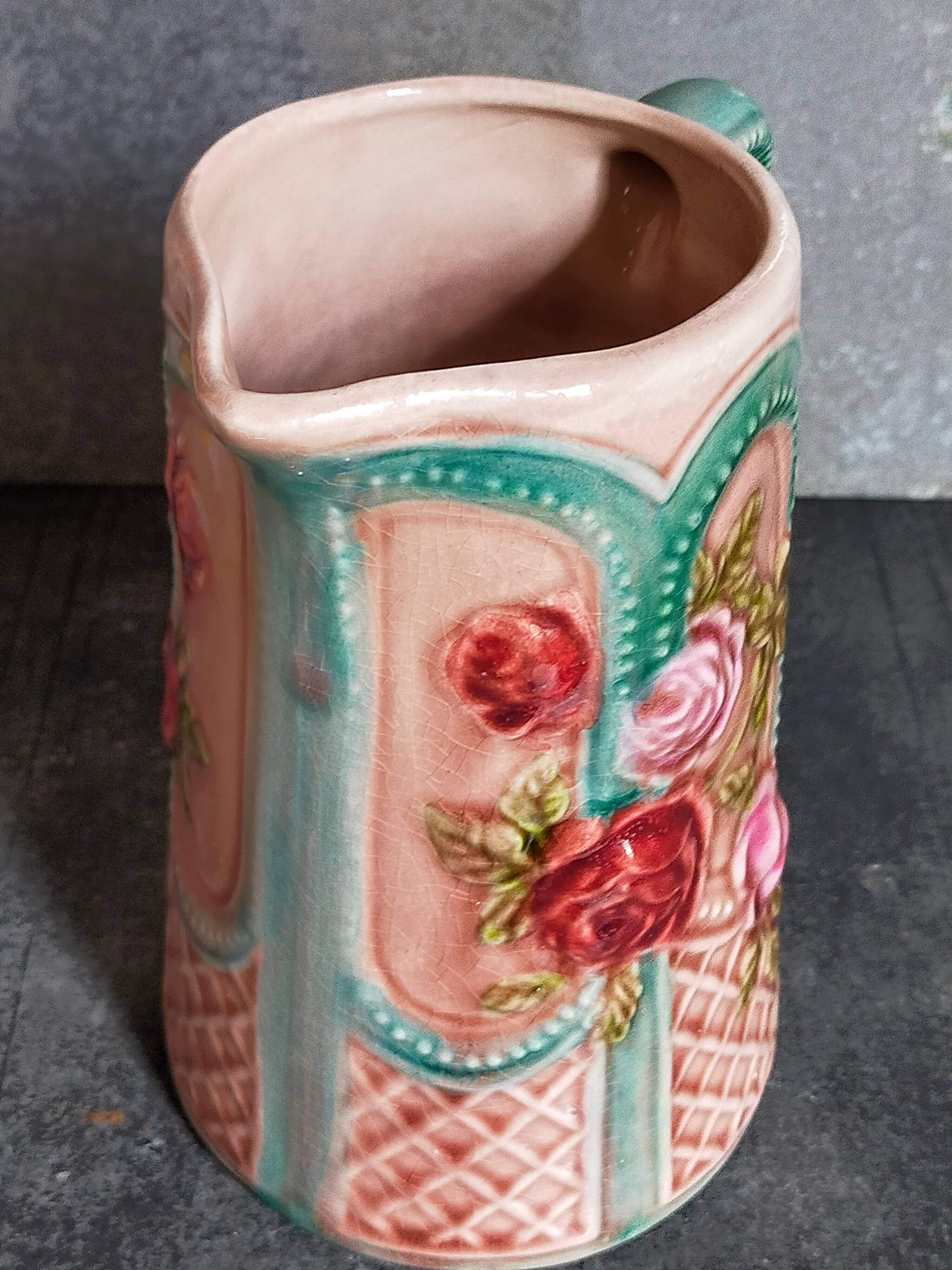 Antique slip pitcher with blooming roses
