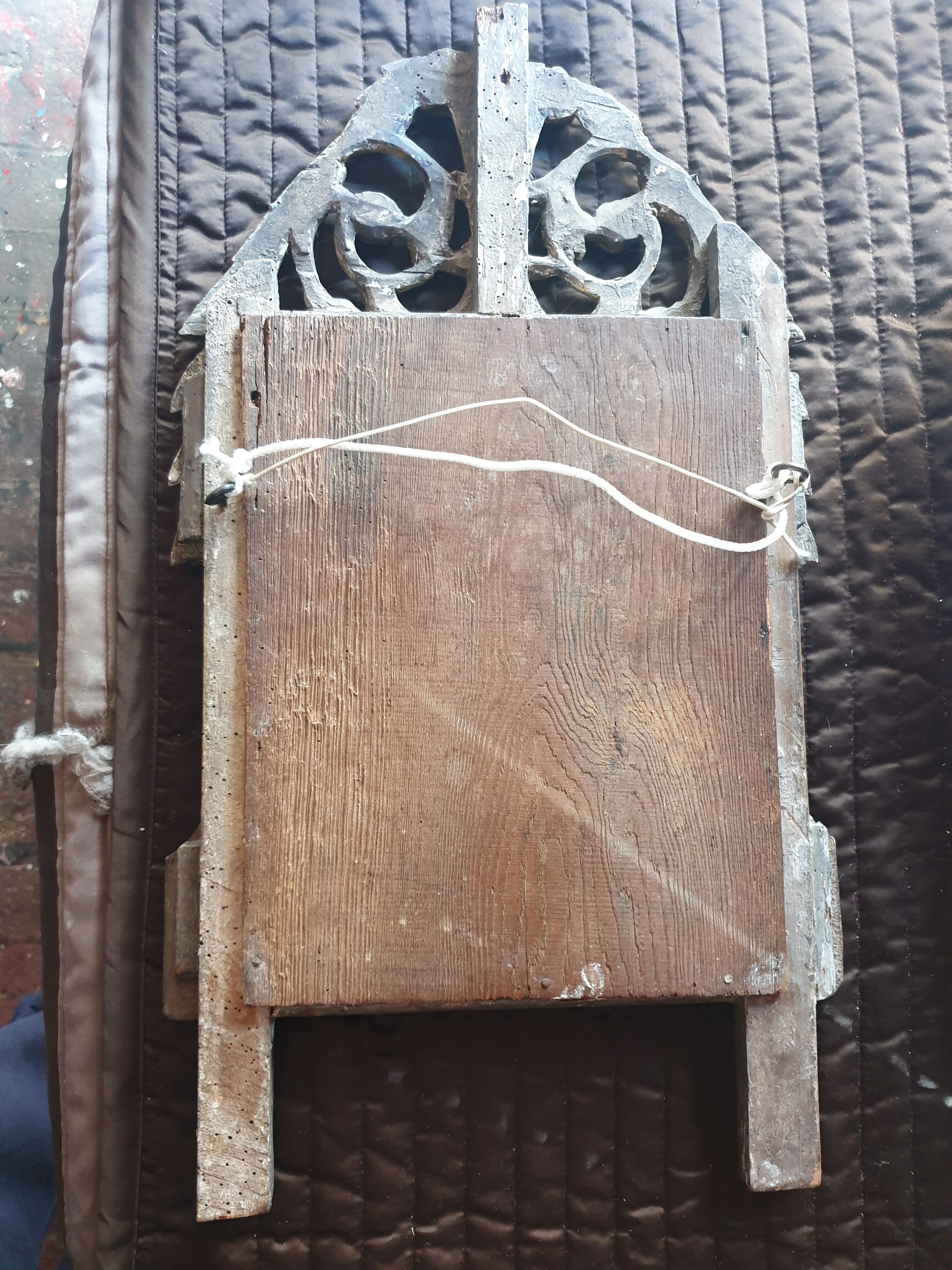 Old mirror in carved and gilded wood