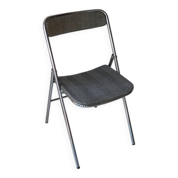 Vintage folding chair in chrome metal and chevron fabric.