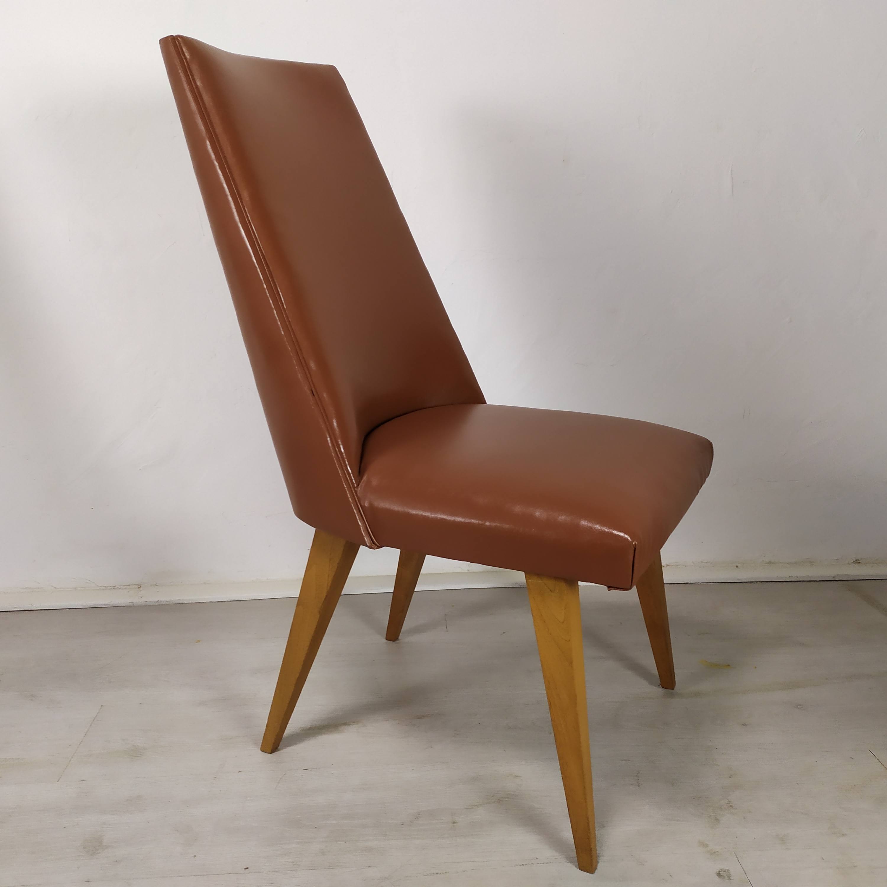 8 brown skai chairs 1950