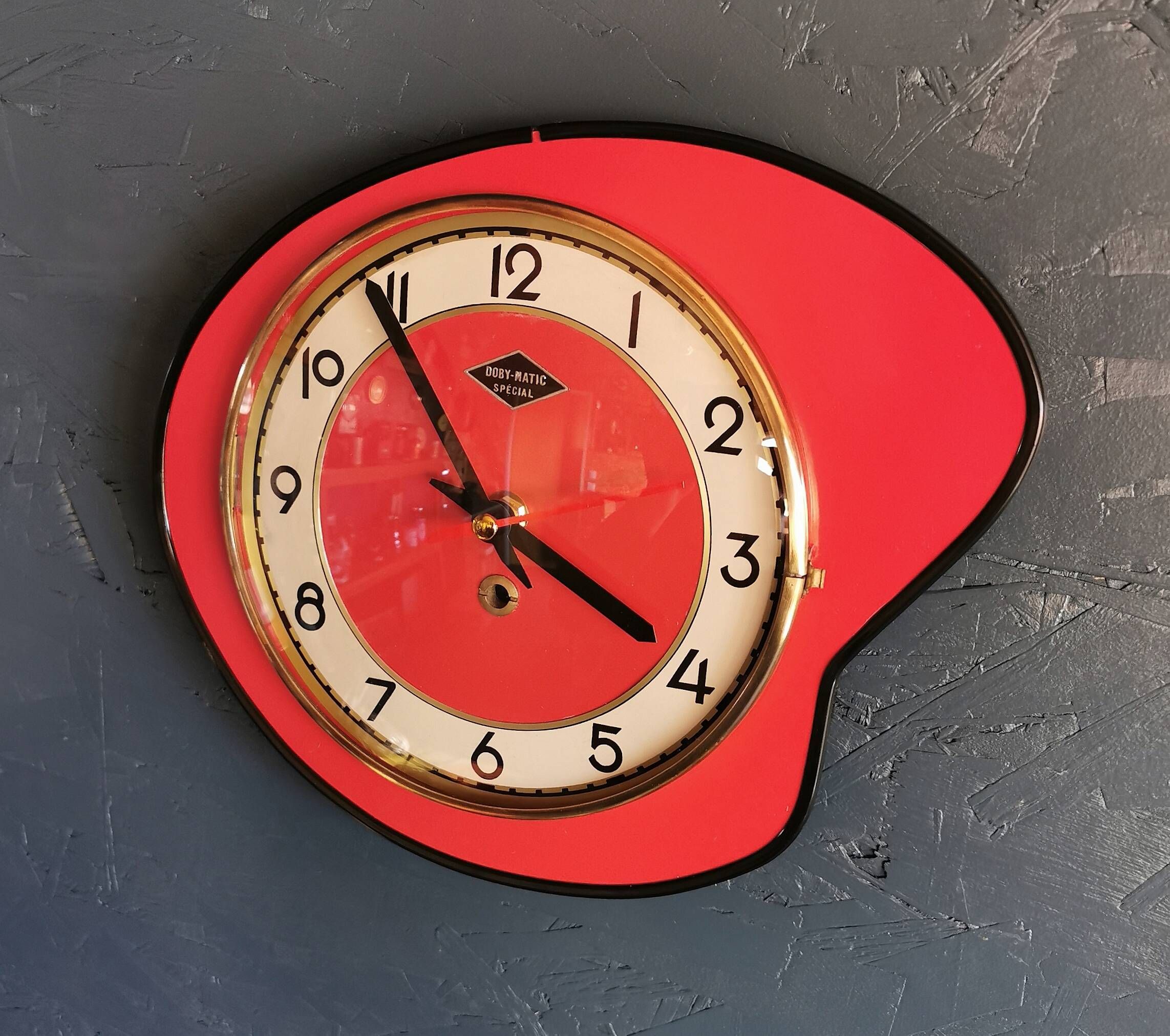 Vintage formica clock silent asymmetrical wall pendulum "Doby Matic red"