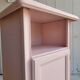 Antique bedside table revamped in pink.