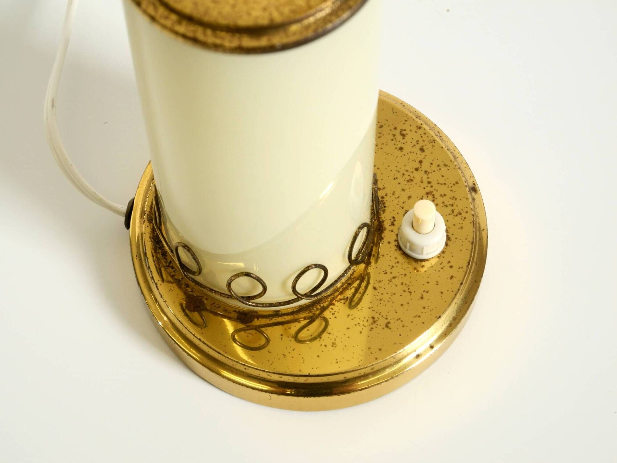 A beautiful, rare 1950s brass table lamp with one opal glass shade adorned