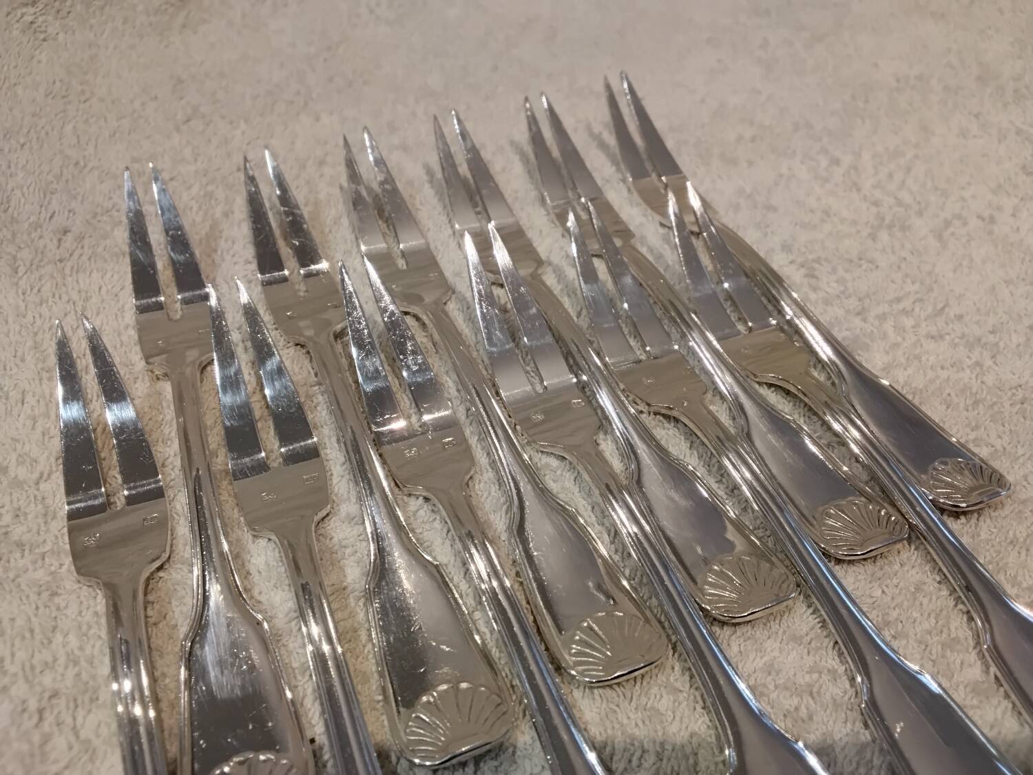 12 silver-plated metal snail forks by silversmith Noel Collet, shell design