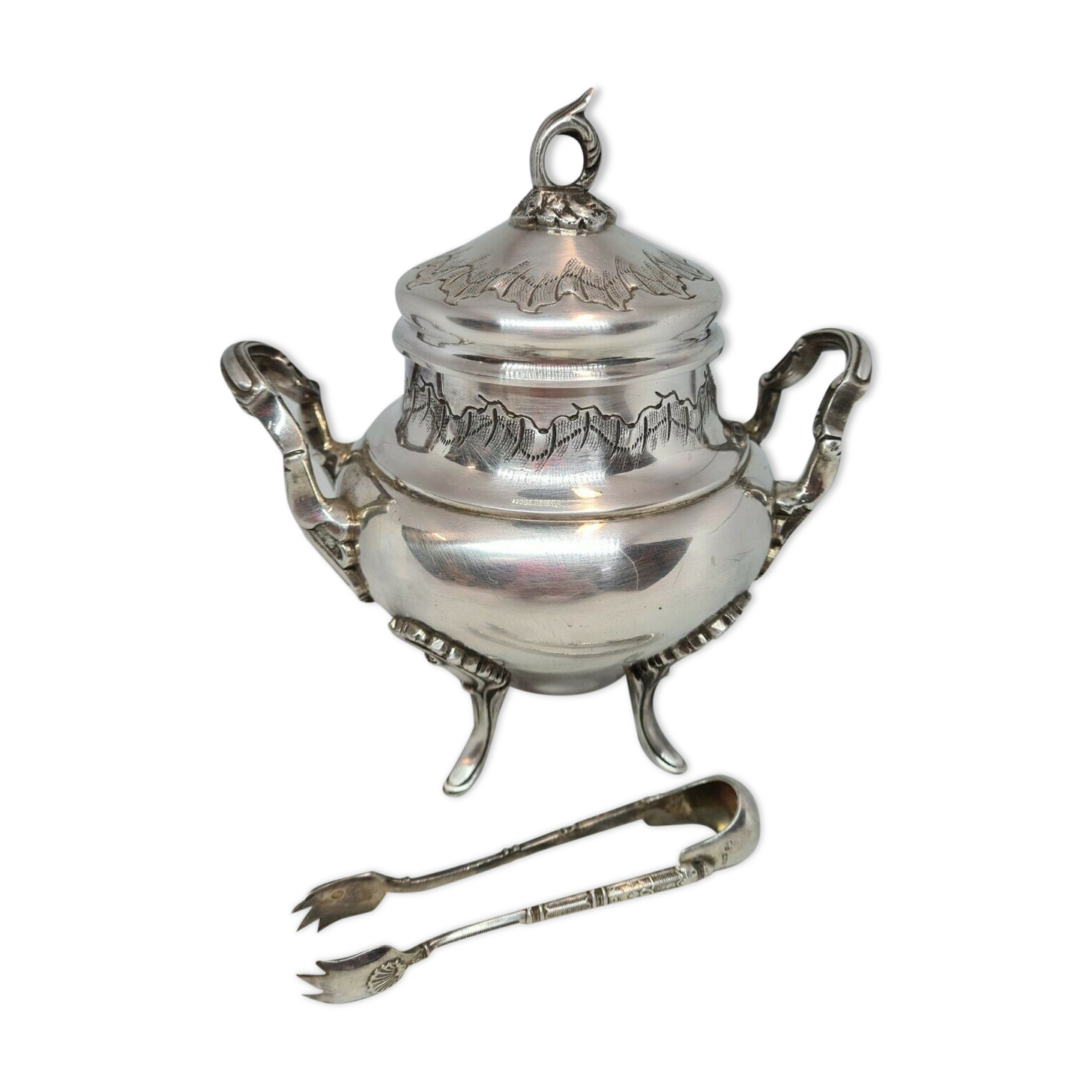 Silver metal sugar bowl with its clamp