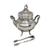 Silver metal sugar bowl with its clamp