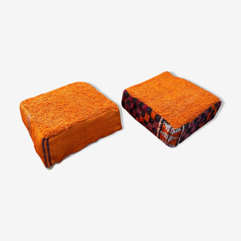 Pair of orange Moroccan wool poufs