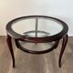 Round mid-century coffee table in walnut with a double top by Paolo Buffa.