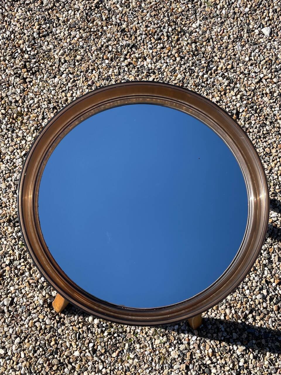 Vintage round smoked plastic mirror, circa 1970s.
