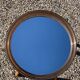 Vintage round smoked plastic mirror, circa 1970s.