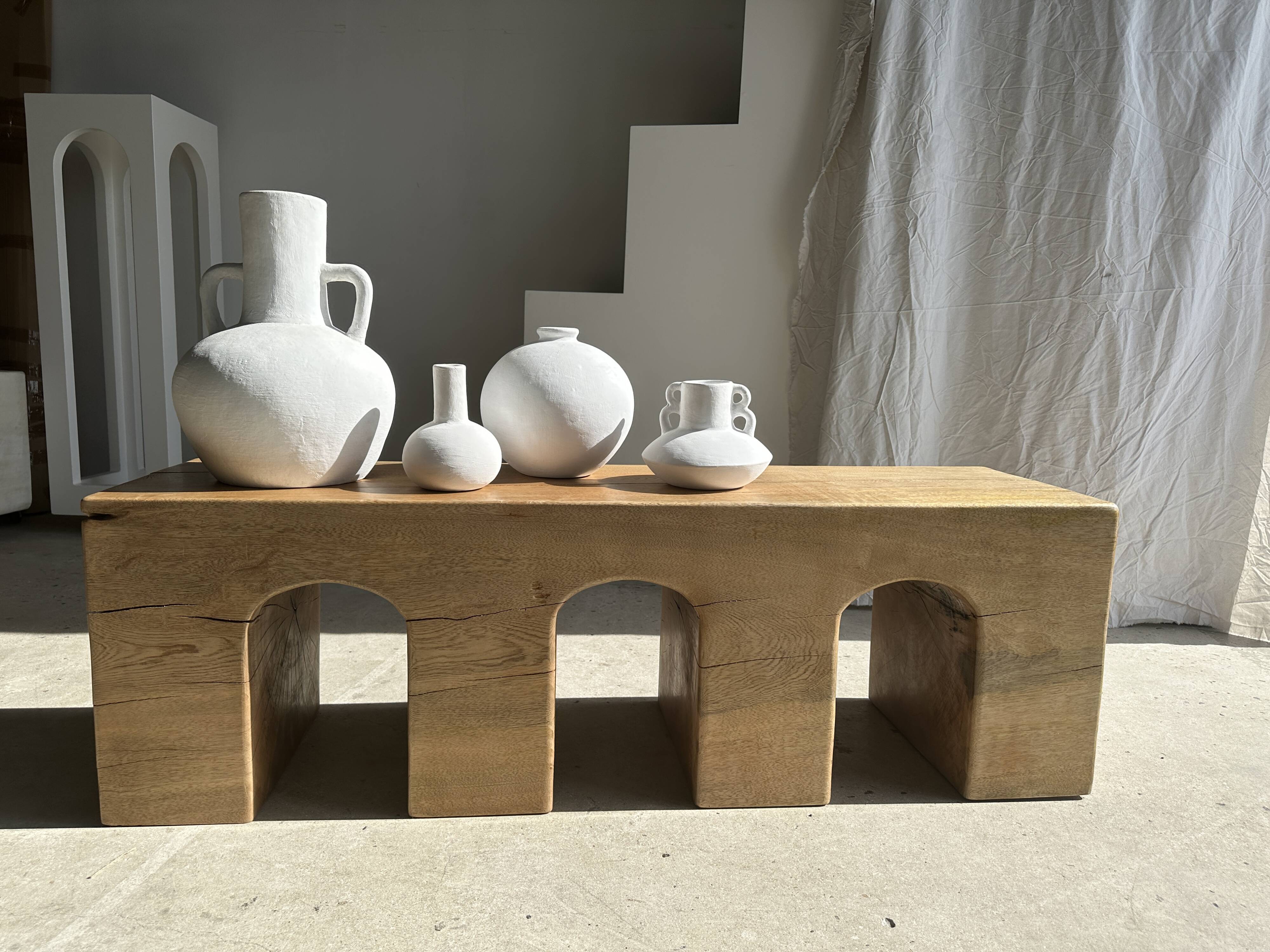 Solid monoxyl wood bench with carved 3-arch base - Natural wood color