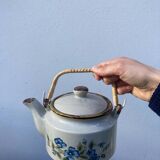 Chinese ceramic and rattan teapot