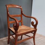 Rustic straw armchair with butts