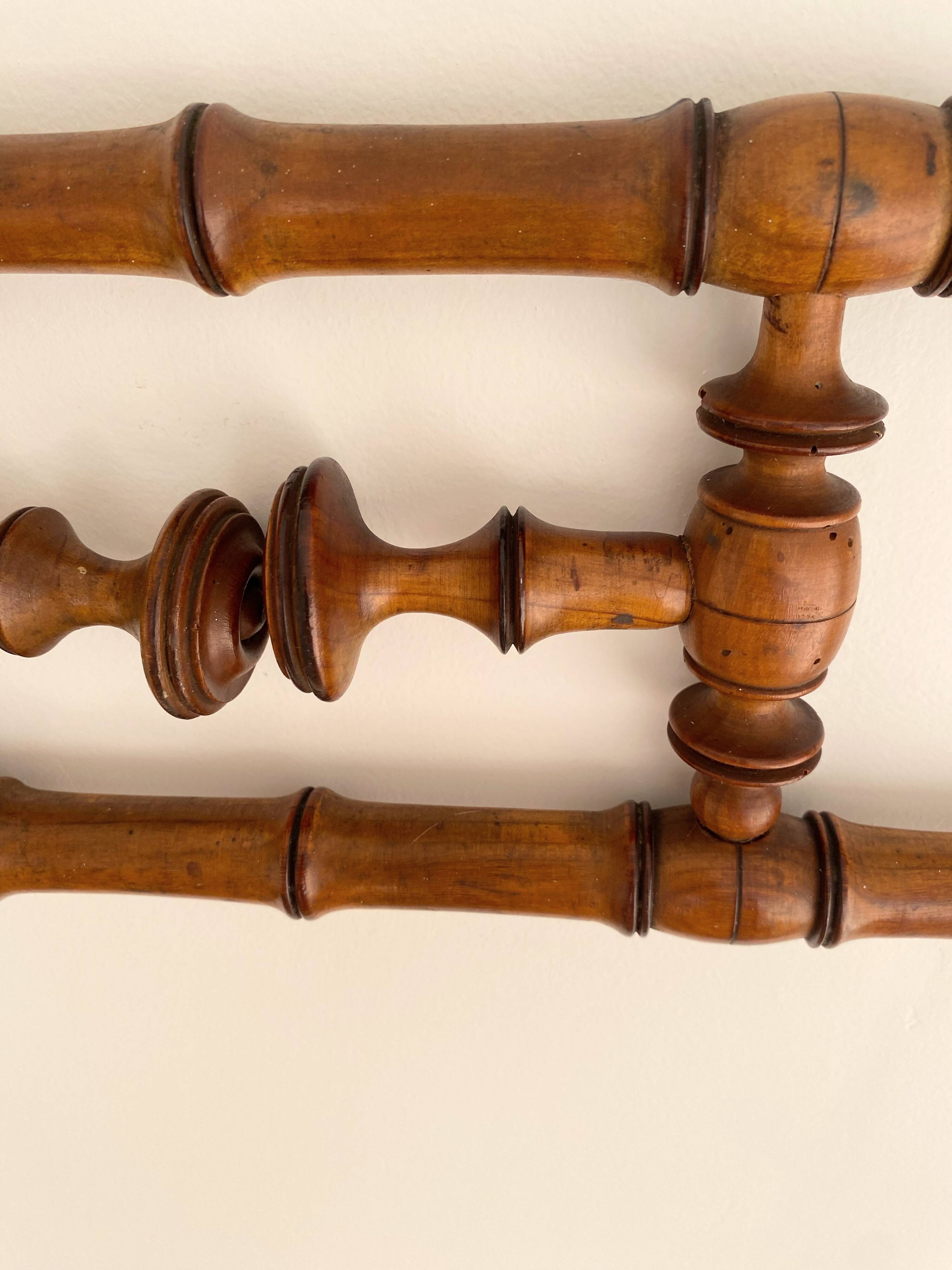 Vintage wooden wall coat rack with 4 swivel hooks from 1920