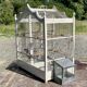 1950s wooden and metal birdcage with period accessories