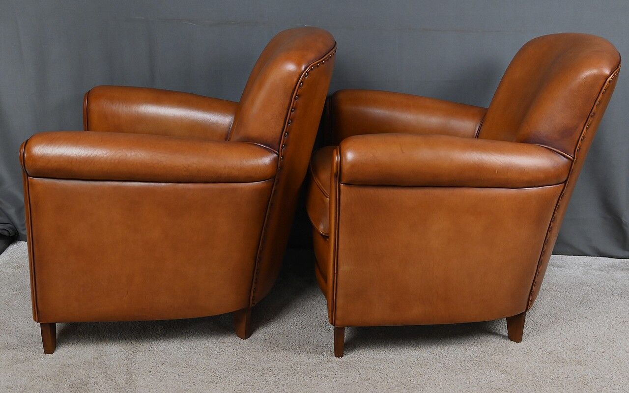 Paire de fauteuils club en cuir