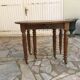 Table ronde 6 pieds 3 rallonges en noyer massif