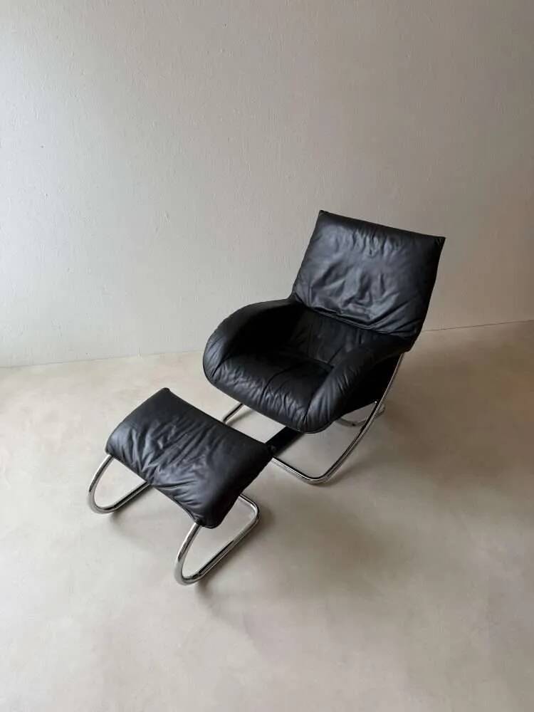 Swiss lounge chair with ottoman by Robert Haussmann from the 1980s.