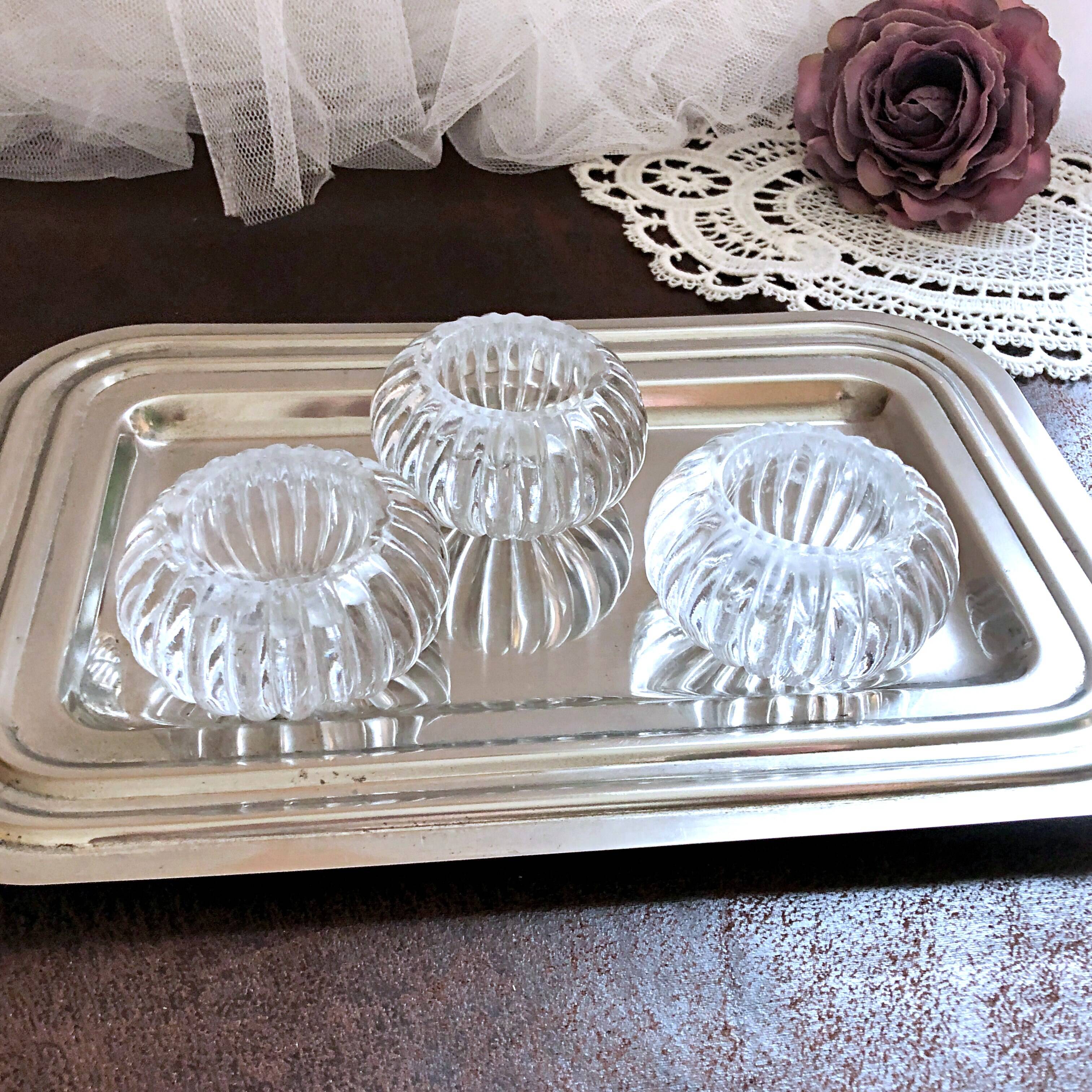 Trio of salt shakers, pepper shakers, molded glass salt shakers