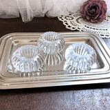 Trio of salt shakers, pepper shakers, molded glass salt shakers