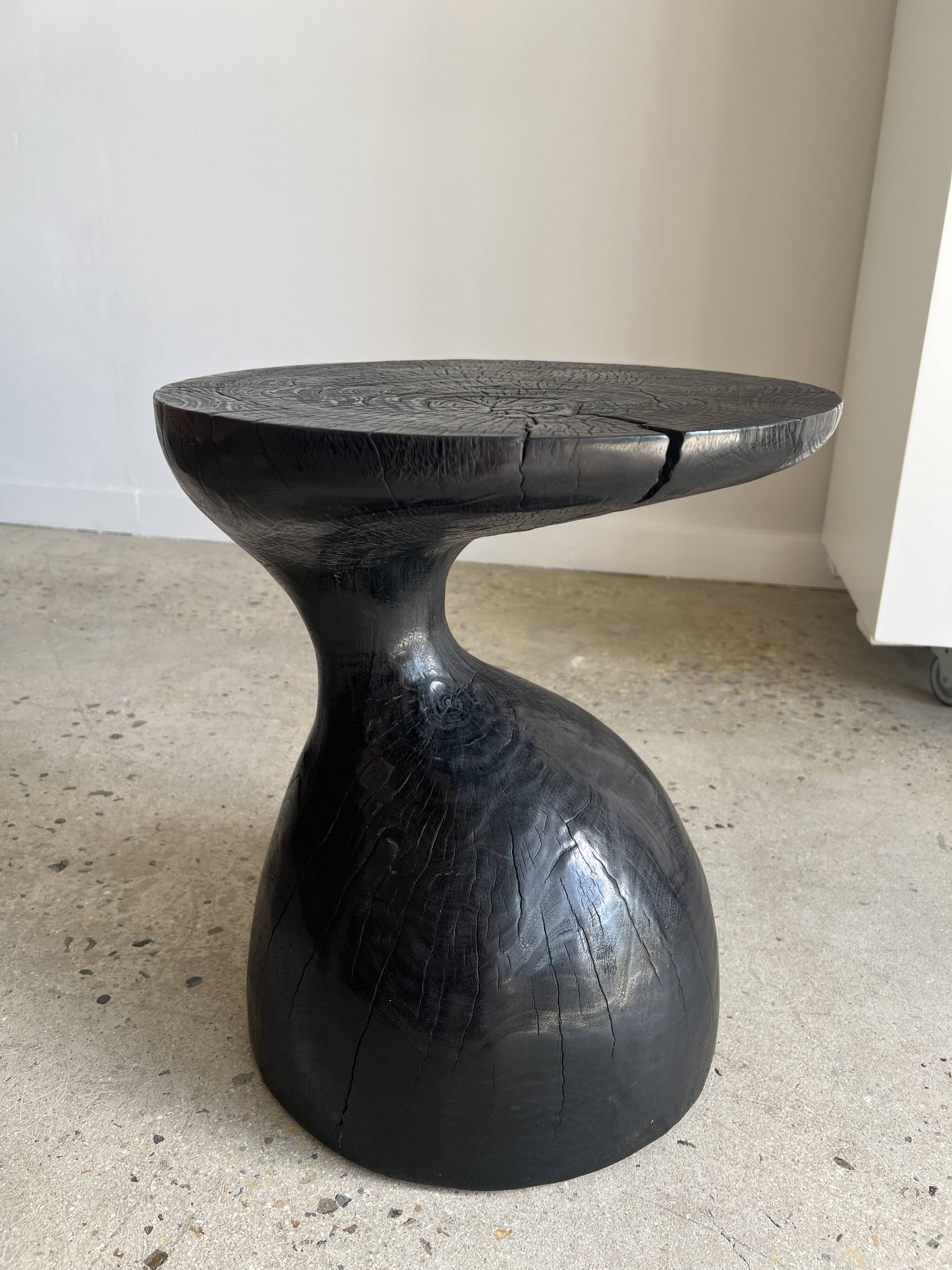 Solid wood (monoxyl) side table, organic shape, black color