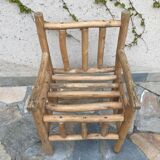 Art-Populaire armchair in raw wood, circa 1950.