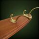 Vintage wooden wall coat rack with 4 double brass hooks – 1950s-60s