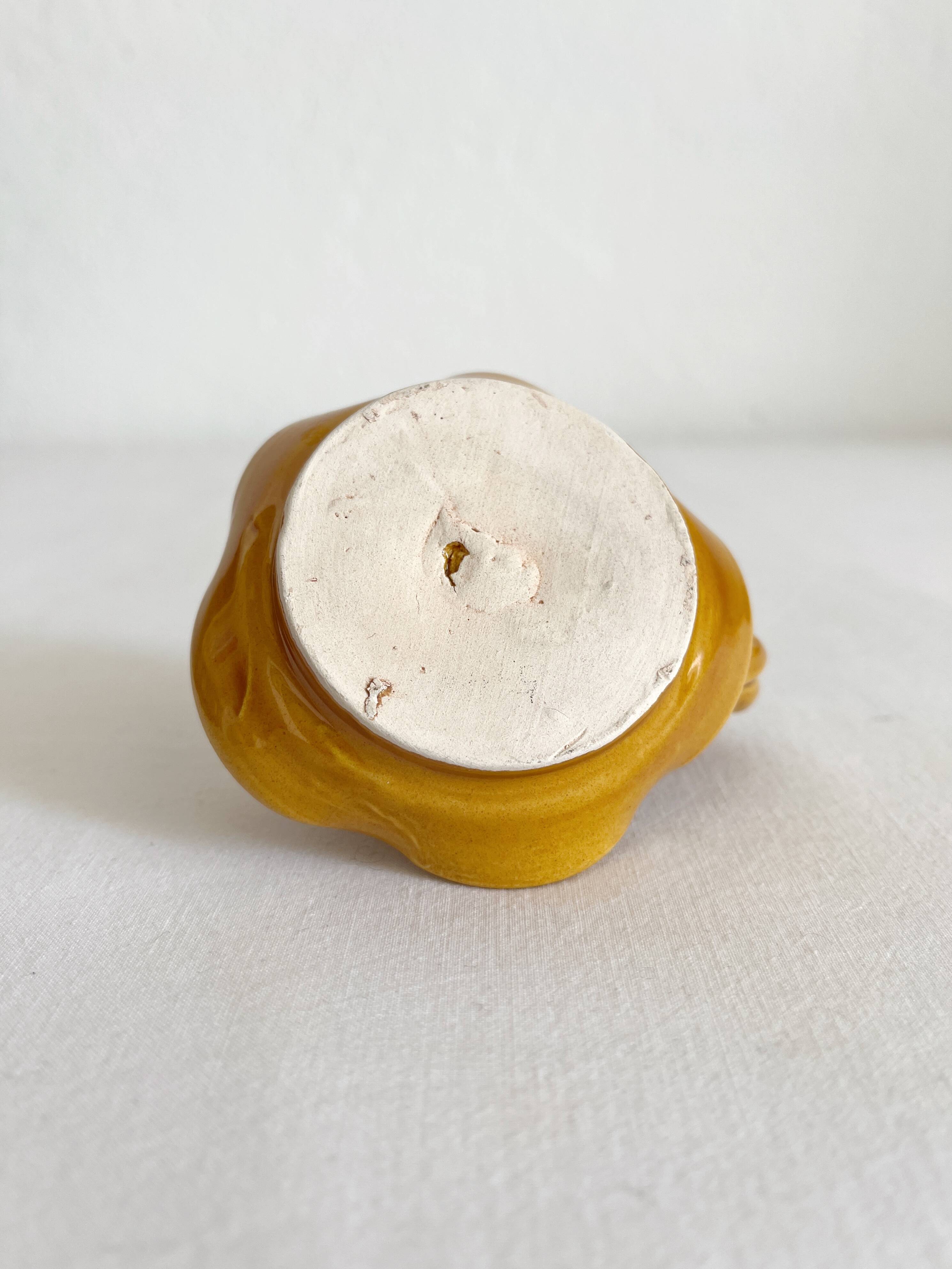 Mustard ceramic candle holder with vintage twisted handle