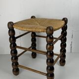 Brutalist wood turned bobbin rush stool in the style of Charles Dudouyt