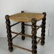 Brutalist wood turned bobbin rush stool in the style of Charles Dudouyt