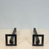 Pair of modernist andirons in steel and wrought iron