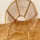 Vintage rattan spiral basket armchair
