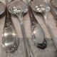 12 silver-plated dessert spoons with rocaille ribbon decoration, 18.5 cm