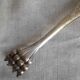 Antique silver-plated sugar tongs with lion's paws.