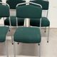 Set of 5 green padded vintage stackable chairs.