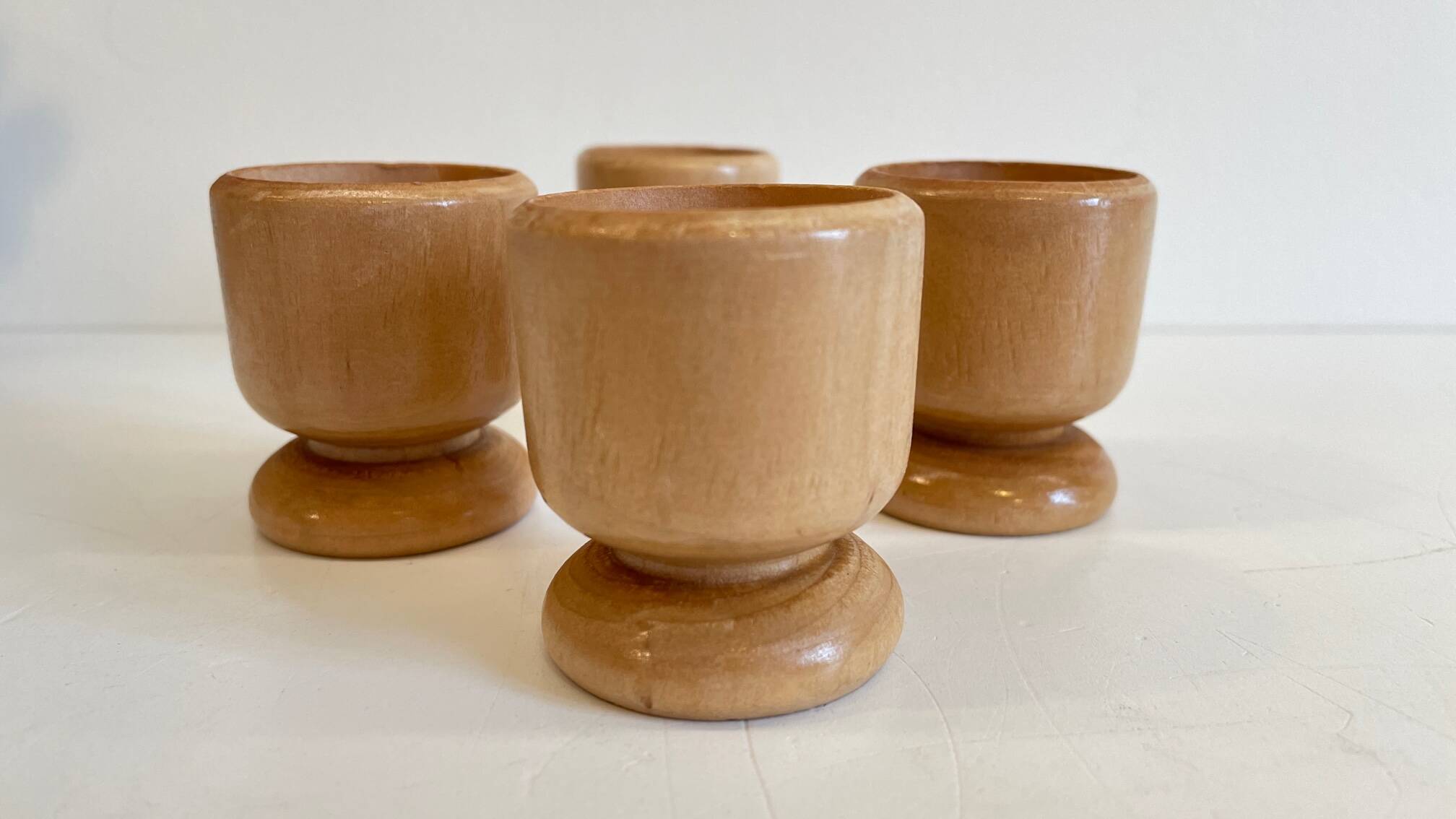 4 vintage turned wooden egg cups