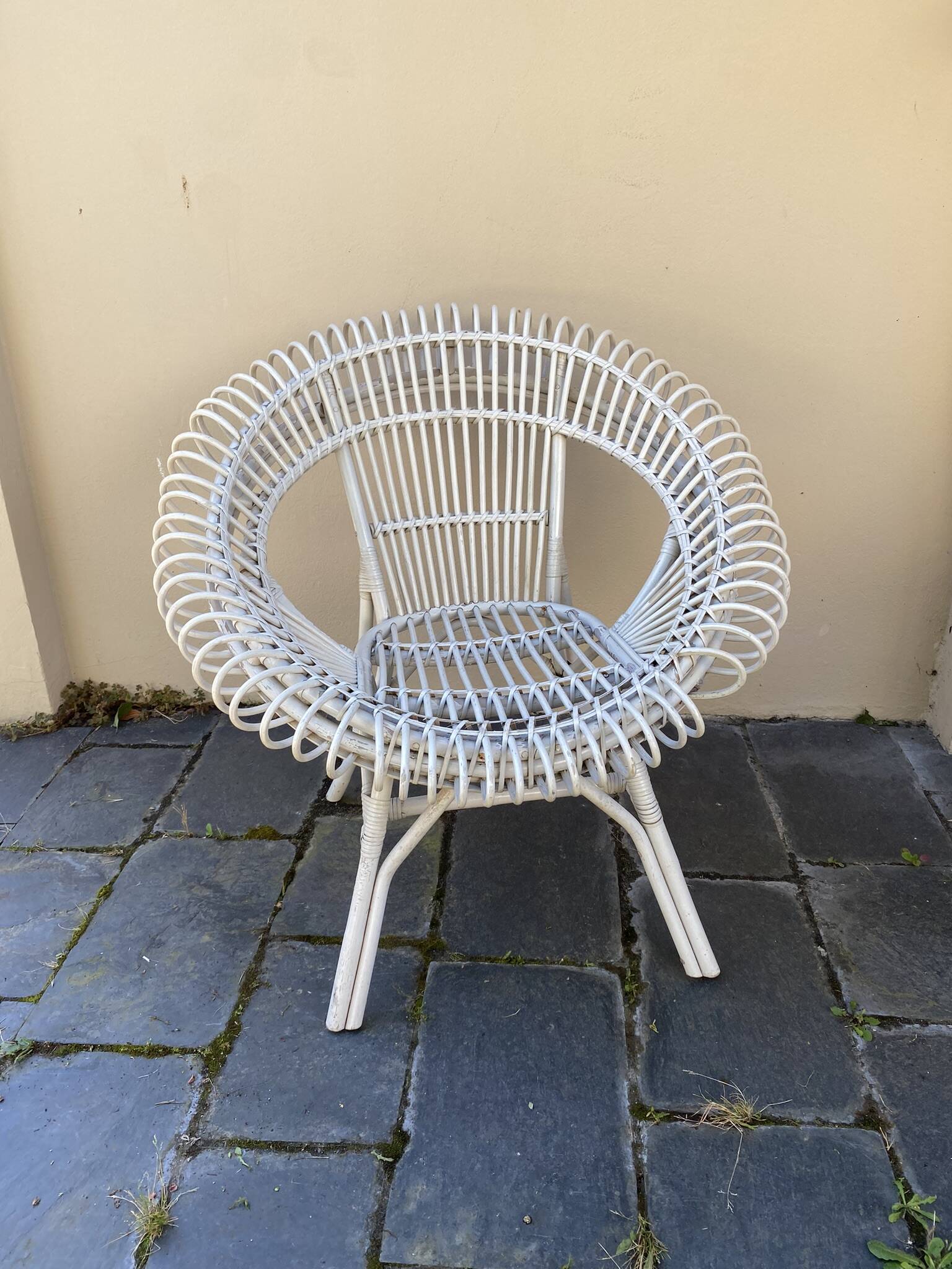 Vintage white rattan armchair