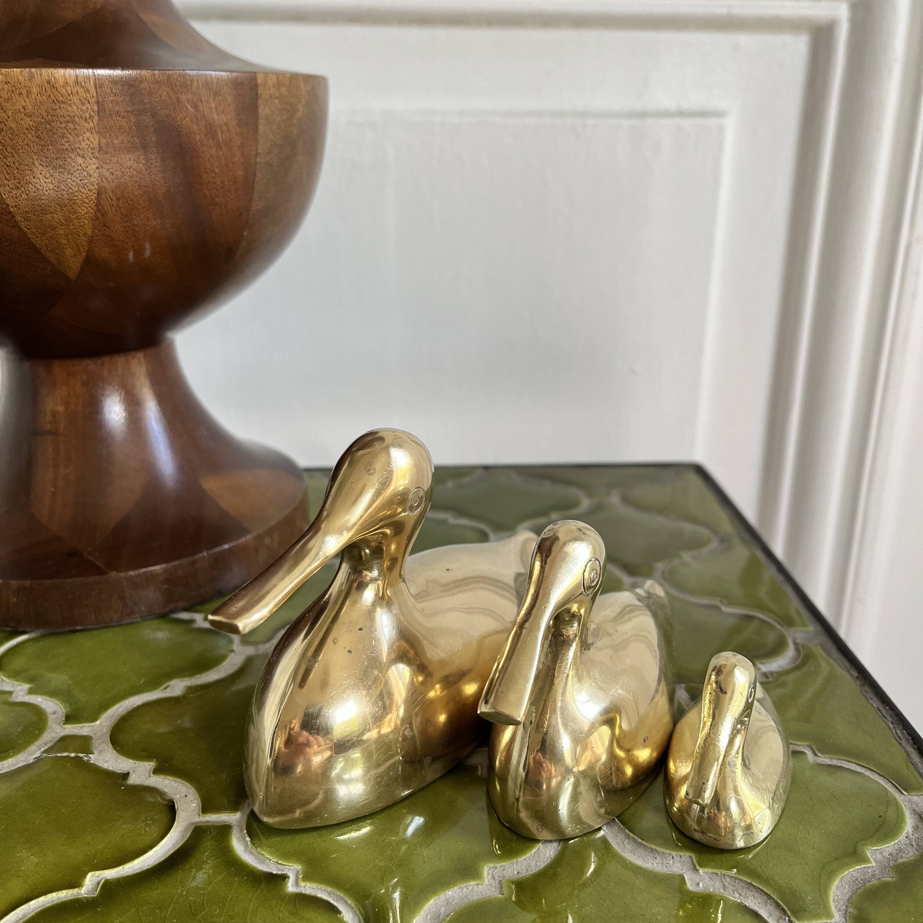 Three brass ducks from the 1950s
