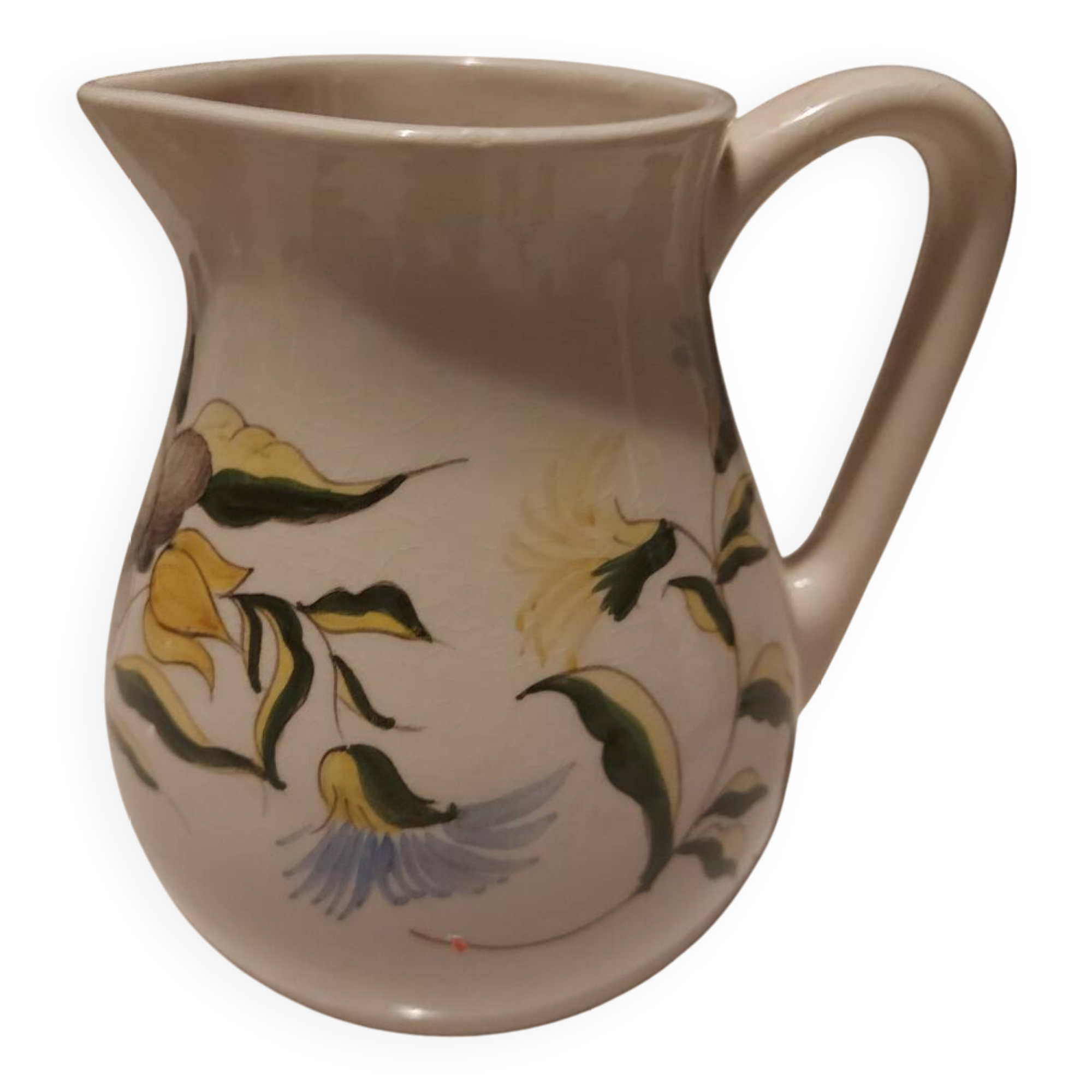 Earthenware pitcher with floral motifs in the Moustiers style, signed.