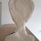 Bust of a woman in anthracite and white plaster