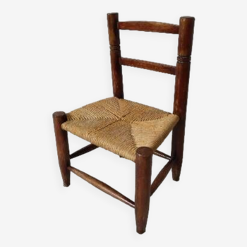 Vintage children's chair in wood and straw