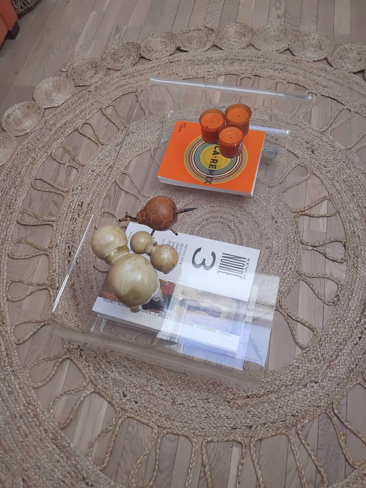 Design coffee table from Habitat in transparent plexiglass, mounted on wheels.