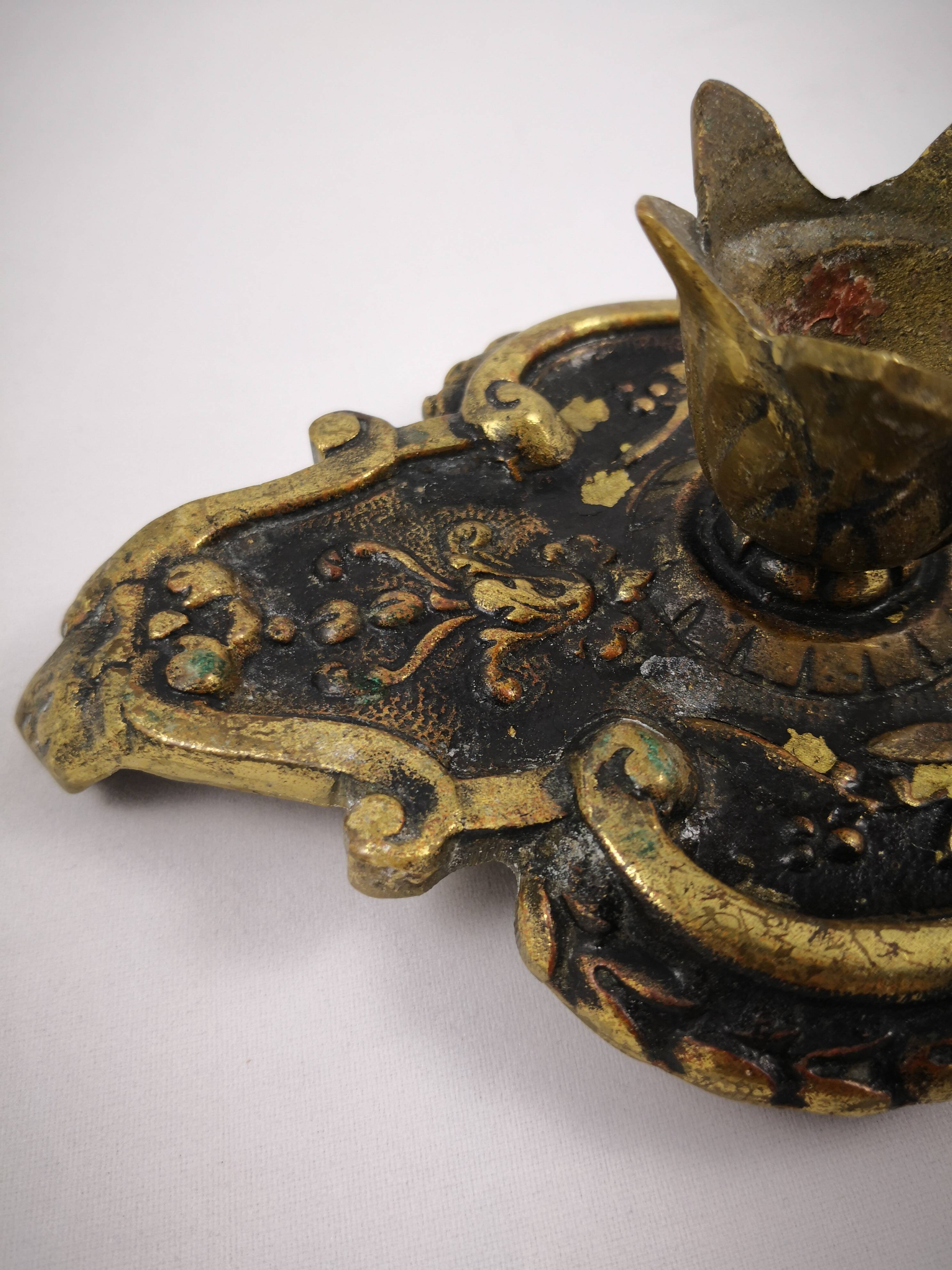 bronze or brass candle holder, cellar level